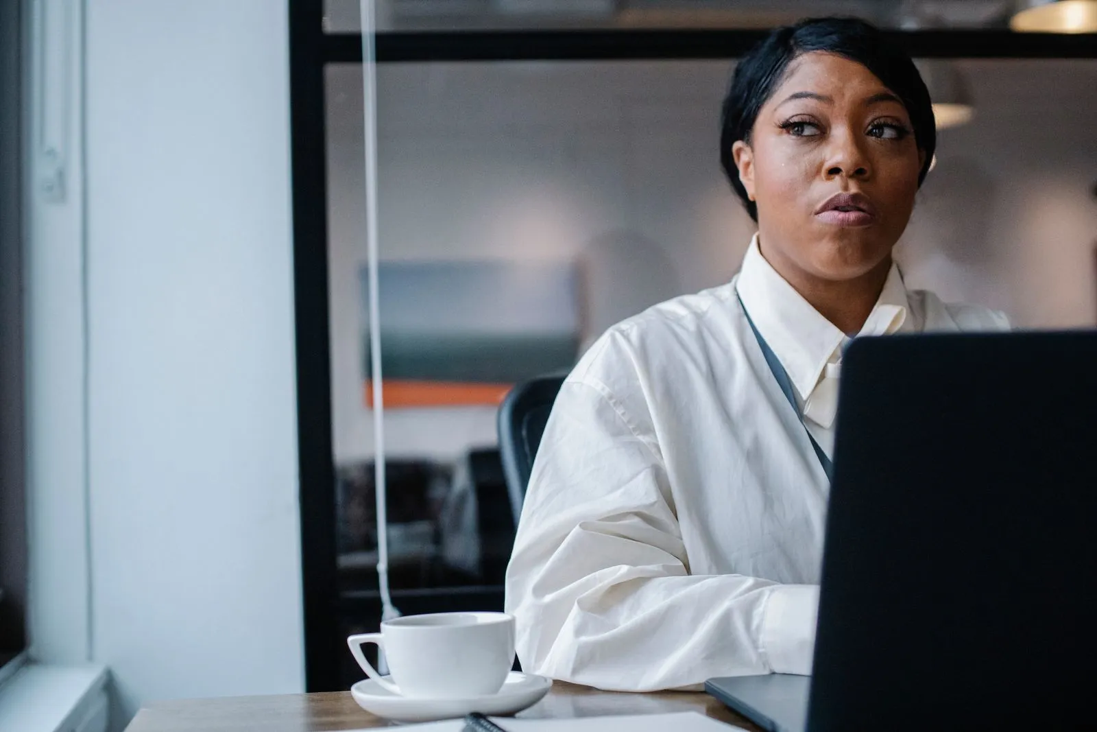 An executive working at a laptop in an office