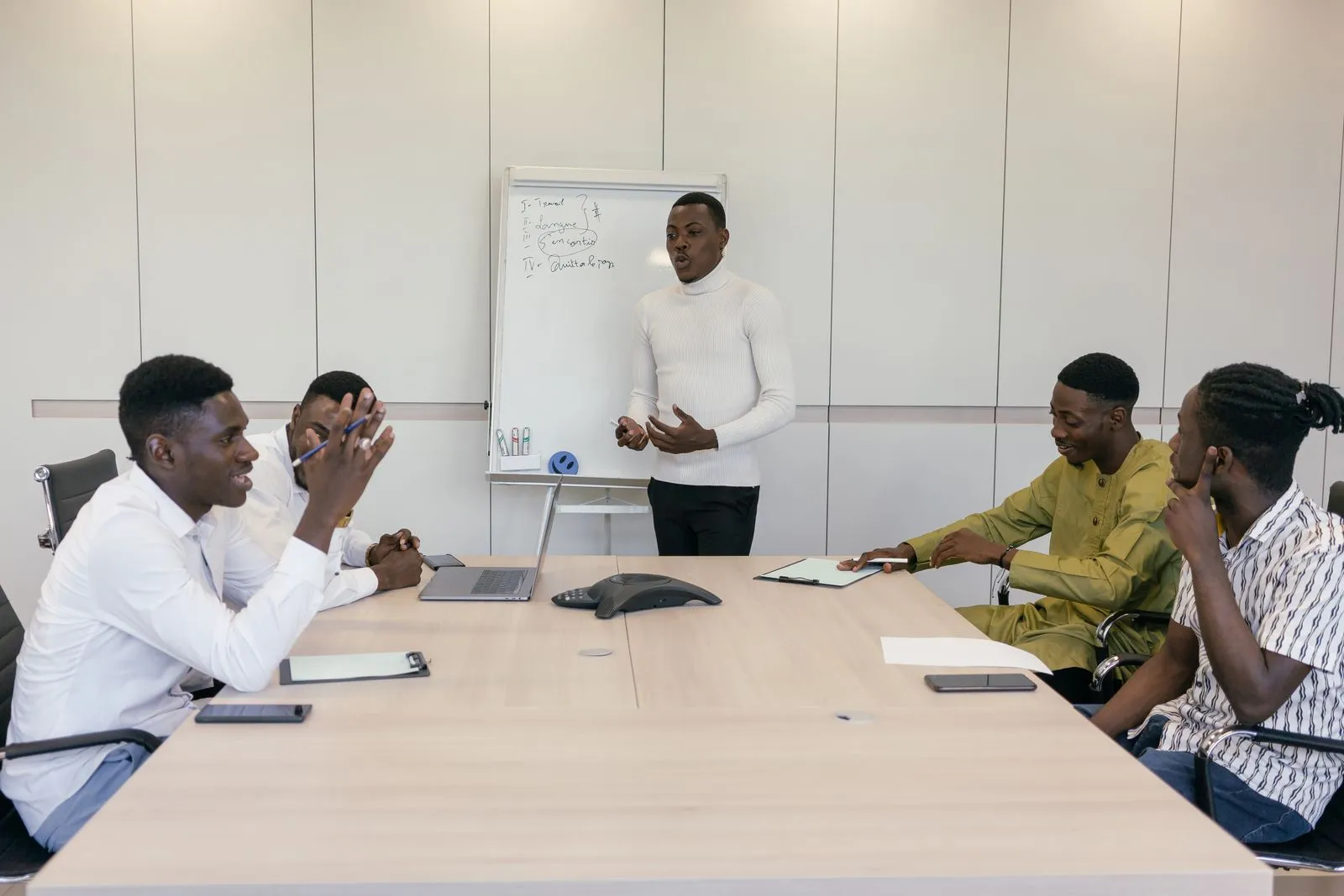 A team meeting around a long table