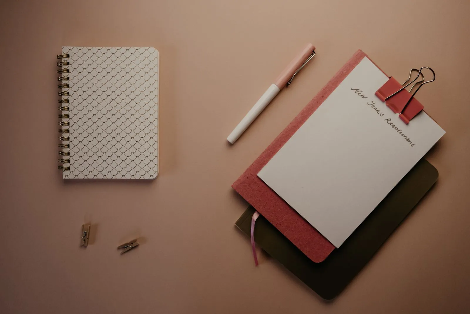 A notebook and pen on a desk